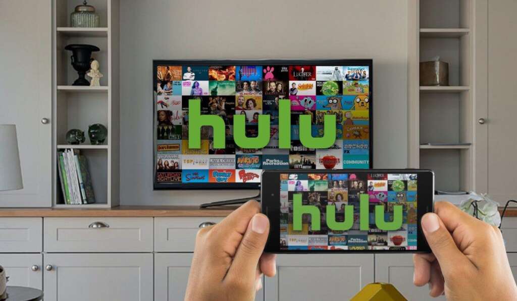An Android smartphone casting Hulu to a TV. The TV stands on a white TV drawer