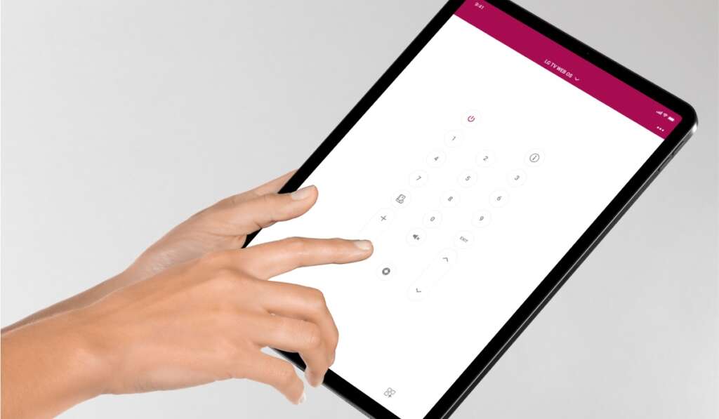 Lg TV remote app on an iPad. A hand using the iPad